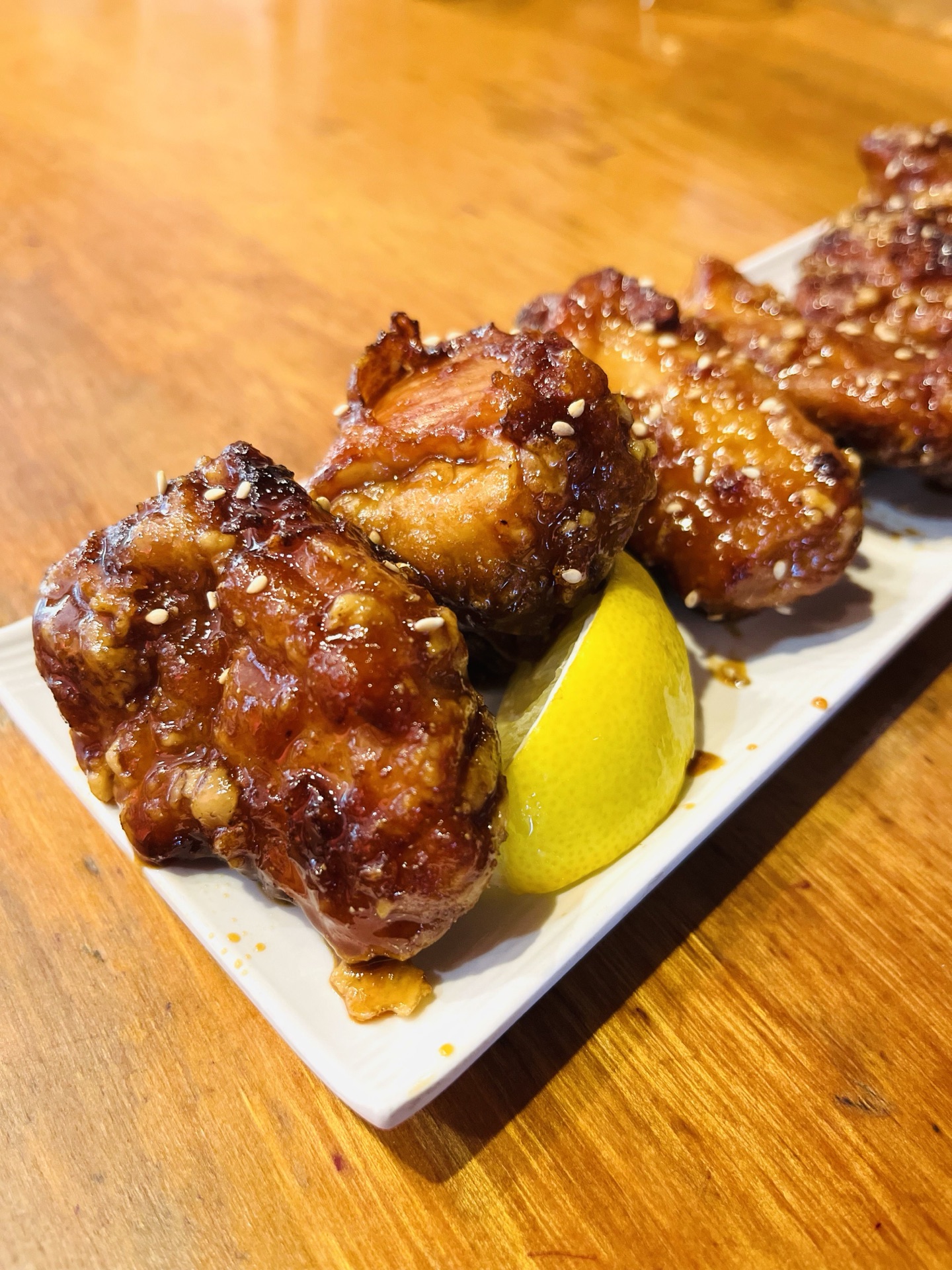 Karaage — crispy Japanese fried chicken with homemade spicy soy sauce, sesame, and lemon